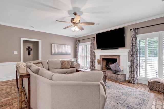 8955 Clair Douwie Cv, Bartlett, TN 38133 - living room with a ceiling fan, healthy amount of natural light, ornamental molding, a fireplace, and brick floors