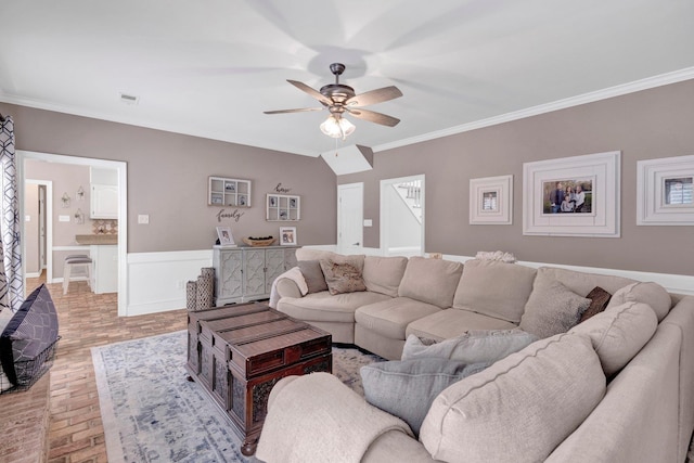8955 Clair Douwie Cv, Bartlett, TN 38133 - living room with ceiling fan, ornamental molding, and a wainscoted wall