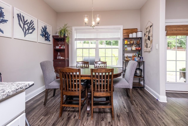 128 Loch Haven Cv S, Atoka, TN 38004 - dining room with dark wood-style flooring, baseboards, and a chandelier