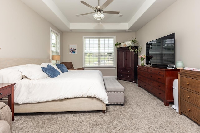 128 Loch Haven Cv S, Atoka, TN 38004 - bedroom featuring light colored carpet, a raised ceiling, and ceiling fan