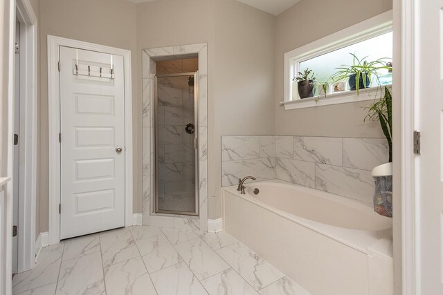 128 Loch Haven Cv S, Atoka, TN 38004 - full bath with a bath, a shower stall, marble look tile flooring, and baseboards
