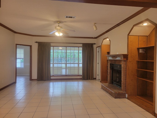 3659 Stonetrace Cir, Bartlett, TN 38135 - unfurnished living room featuring a ceiling fan, a brick fireplace, light tile patterned flooring, crown molding, and baseboards
