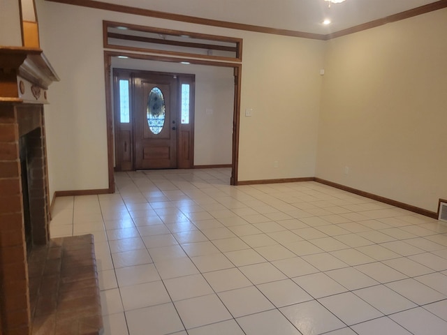 3659 Stonetrace Cir, Bartlett, TN 38135 - entryway with ornamental molding, baseboards, a fireplace, and light tile patterned flooring
