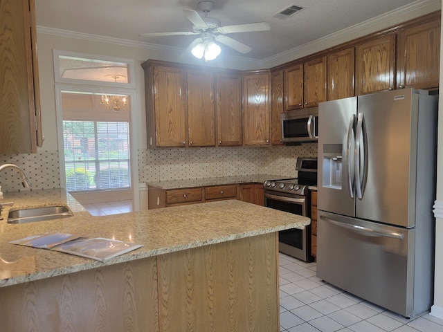 3659 Stonetrace Cir, Bartlett, TN 38135 - kitchen with stainless steel appliances, a sink, backsplash, ceiling fan, and ornamental molding