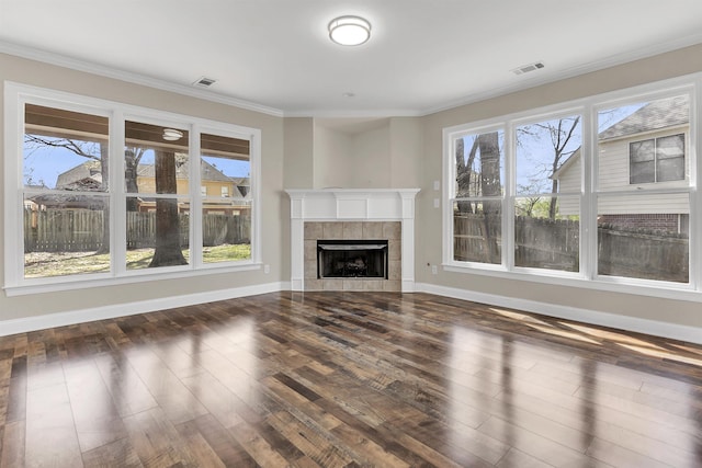 8917 River Sound Dr, Cordova, TN 38016 - unfurnished living room featuring plenty of natural light, dark wood-style flooring, baseboards, and ornamental molding