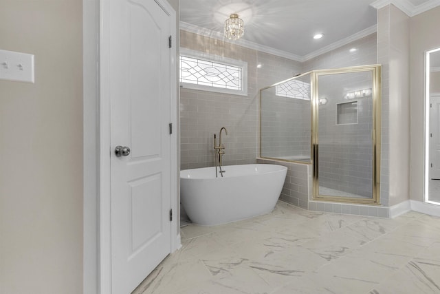8917 River Sound Dr, Cordova, TN 38016 - bathroom with ornamental molding, a soaking tub, a stall shower, and marble finish flooring