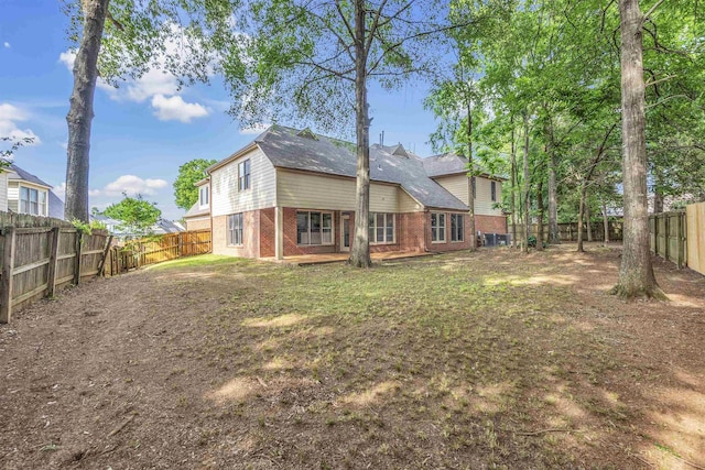 8917 River Sound Dr, Cordova, TN 38016 - rear view of property with brick siding and a fenced backyard