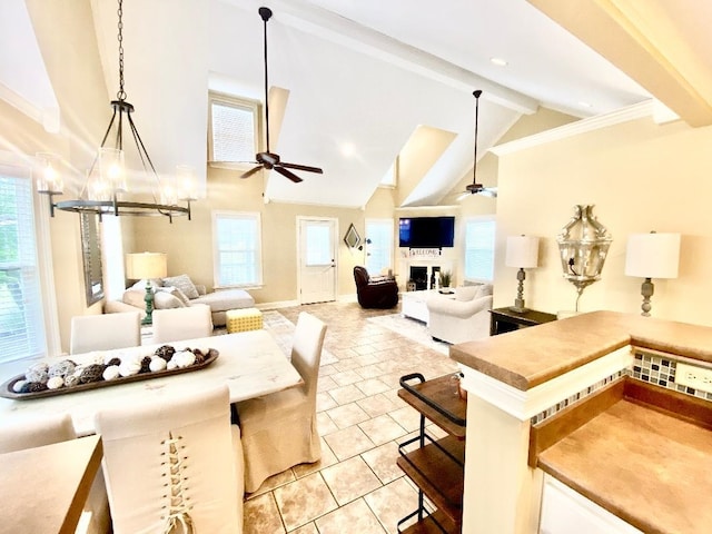 29 Frank Fwy, Iuka, MS 38852 - living room with ceiling fan, beamed ceiling, a chandelier, light tile patterned flooring, and high vaulted ceiling