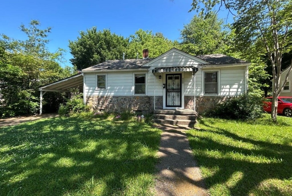 4290 Zelda Ln, Memphis, TN 38122 - bungalow featuring stone siding, a front lawn, and a chimney