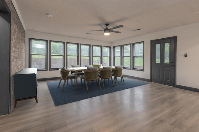 268 Tara Cv, Hernando, MS 38632 - dining area featuring baseboards, a ceiling fan, wood finished floors, and a textured ceiling