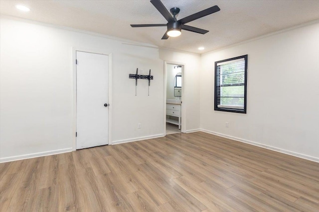 268 Tara Cv, Hernando, MS 38632 - unfurnished bedroom featuring wood finished floors, crown molding, baseboards, ensuite bathroom, and recessed lighting