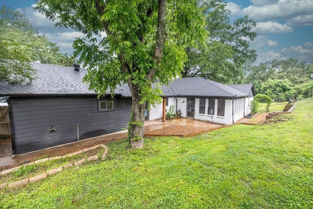 268 Tara Cv, Hernando, MS 38632 - rear view of house featuring a patio area, a yard, and roof with shingles