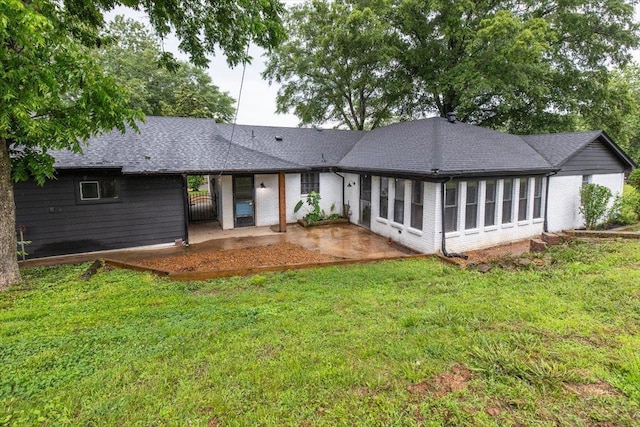 268 Tara Cv, Hernando, MS 38632 - back of property featuring a patio, a yard, and roof with shingles