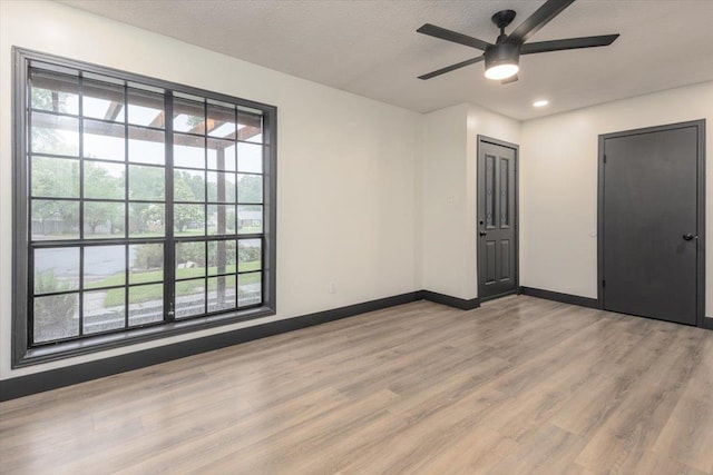 268 Tara Cv, Hernando, MS 38632 - unfurnished room featuring baseboards, light wood-type flooring, ceiling fan, a textured ceiling, and recessed lighting