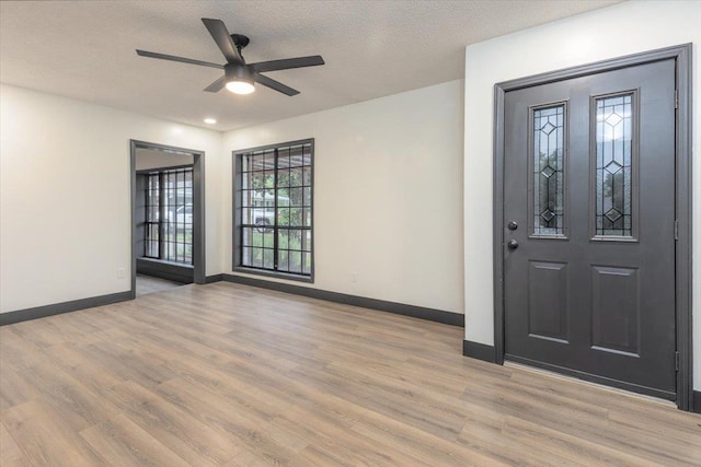268 Tara Cv, Hernando, MS 38632 - entrance foyer with ceiling fan, light wood finished floors, baseboards, and a textured ceiling
