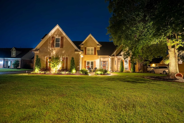 12262 Kathleen Cv, Arlington, TN 38002 - traditional-style home with a lawn and brick siding