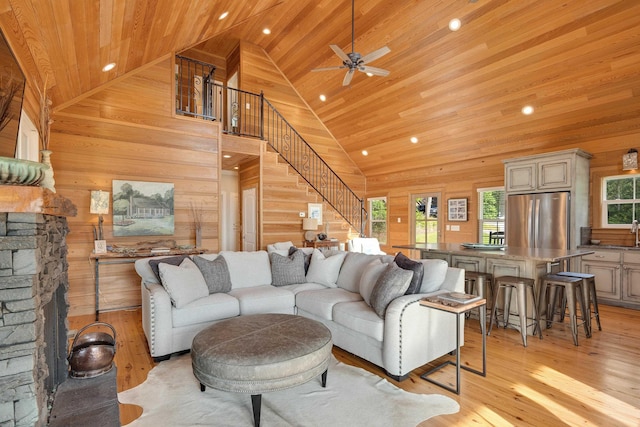 8 Shady Oak Cv, Iuka, MS 38852 - living room with wood ceiling, wood walls, a ceiling fan, recessed lighting, and light wood finished floors