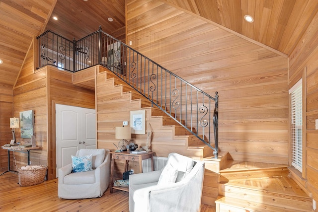 8 Shady Oak Cv, Iuka, MS 38852 - staircase with wooden ceiling, wood walls, wood finished floors, recessed lighting, and a high ceiling