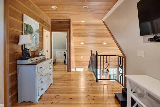 8 Shady Oak Cv, Iuka, MS 38852 - hall with an upstairs landing, light wood finished floors, wooden walls, recessed lighting, and wooden ceiling