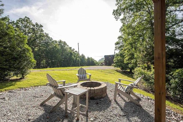8 Shady Oak Cv, Iuka, MS 38852 - view of green lawn with a fire pit