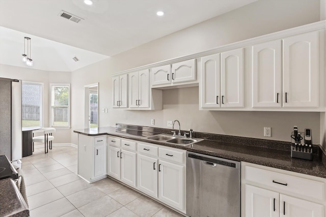 9071 E Tefall Cv, Cordova, TN 38016 - kitchen with stainless steel appliances, a sink, light tile patterned flooring, white cabinetry, and dark countertops