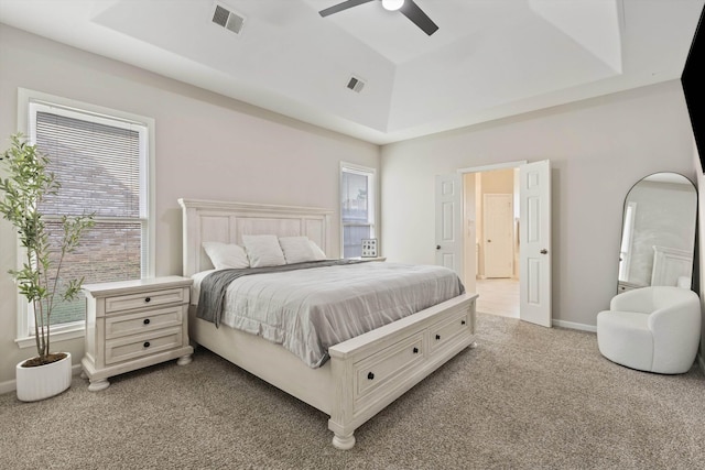 9071 E Tefall Cv, Cordova, TN 38016 - bedroom featuring a raised ceiling, carpet, multiple windows, and a ceiling fan