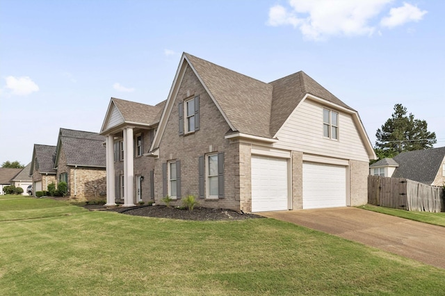 9071 E Tefall Cv, Cordova, TN 38016 - view of front of home with a garage, brick siding, driveway, and a shingled roof