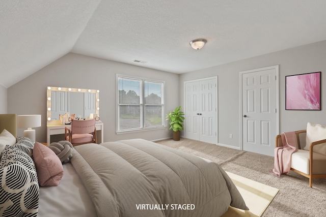 9071 E Tefall Cv, Cordova, TN 38016 - bedroom with carpet flooring, multiple closets, and lofted ceiling