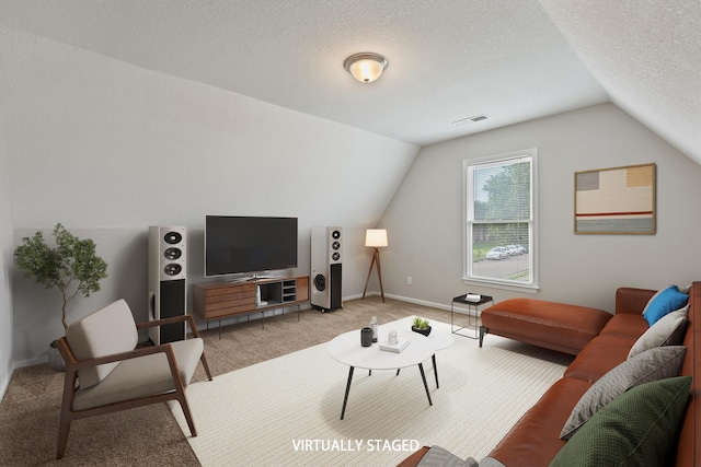 9071 E Tefall Cv, Cordova, TN 38016 - living room with vaulted ceiling, light colored carpet, a textured ceiling, and baseboards