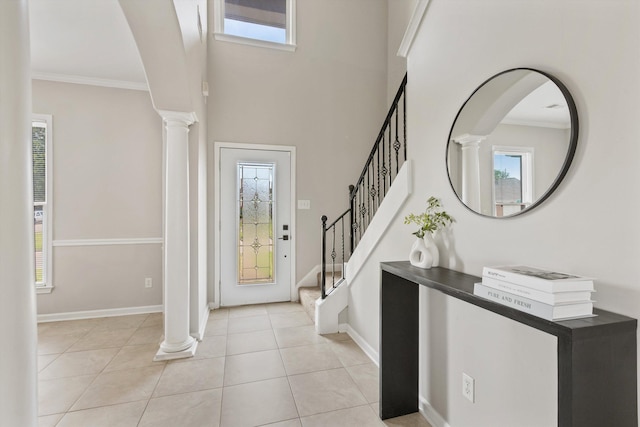 9071 E Tefall Cv, Cordova, TN 38016 - foyer entrance with decorative columns, healthy amount of natural light, ornamental molding, light tile patterned flooring, and baseboards
