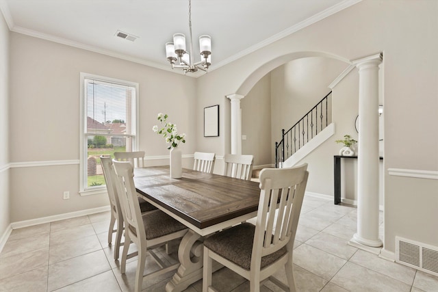 9071 E Tefall Cv, Cordova, TN 38016 - dining space featuring ornate columns, ornamental molding, light tile patterned floors, a chandelier, and baseboards