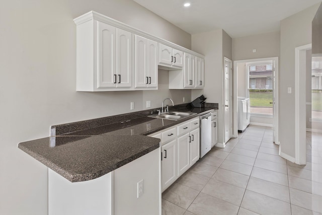 9071 E Tefall Cv, Cordova, TN 38016 - kitchen featuring a sink, dishwasher, white cabinetry, a peninsula, and washer / clothes dryer