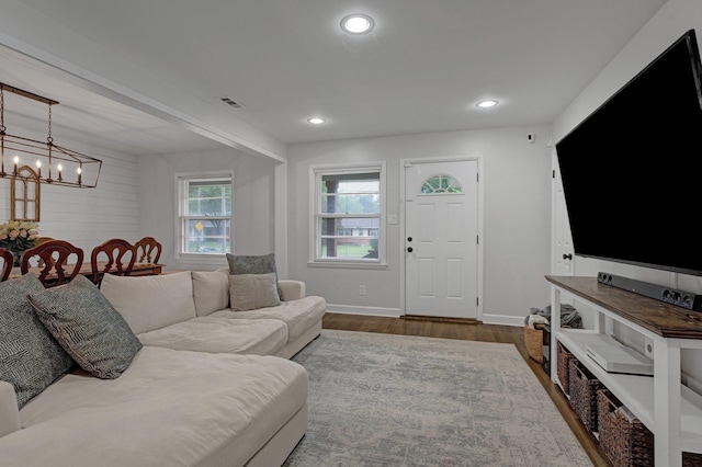 624 N Oak Grove Rd N, Memphis, TN 38120 - living room with a chandelier, dark wood-style flooring, baseboards, and recessed lighting