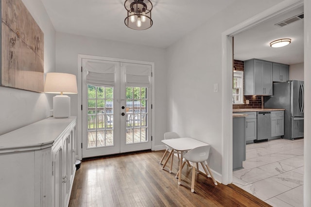 624 N Oak Grove Rd N, Memphis, TN 38120 - kitchen featuring gray cabinets, stainless steel appliances, french doors, and light countertops