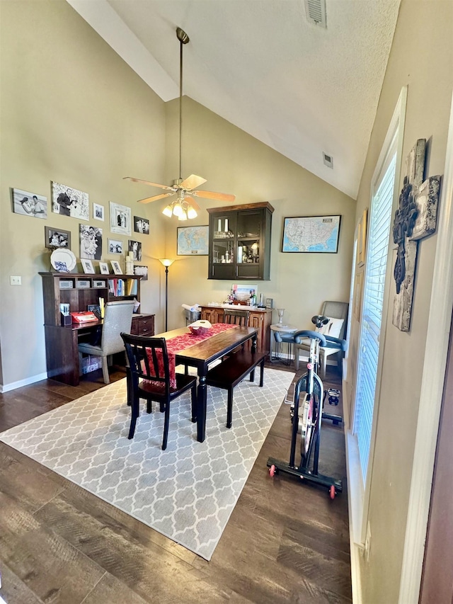 150 Westwood Cir, Ripley, TN 38063 - dining area featuring wood finished floors, ceiling fan, baseboards, and high vaulted ceiling