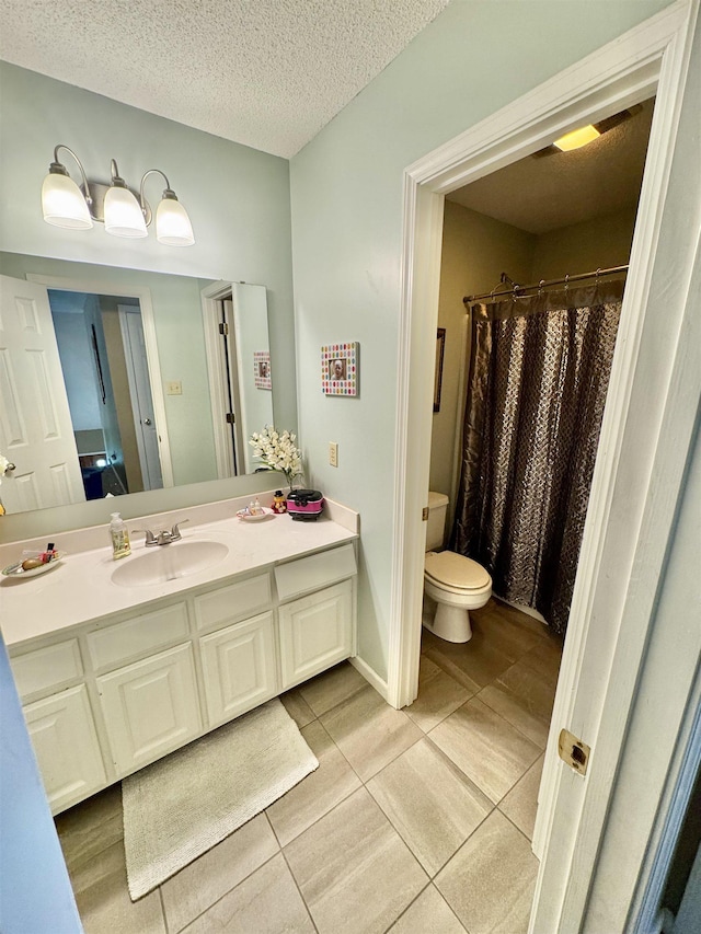 150 Westwood Cir, Ripley, TN 38063 - bathroom with toilet, vanity, tile patterned flooring, curtained shower, and a textured ceiling