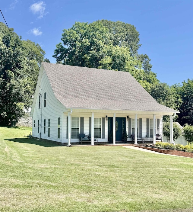 150 Westwood Cir, Ripley, TN 38063 - view of front of house featuring covered porch, a front lawn, and a shingled roof