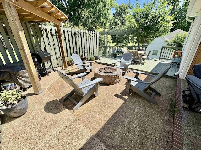 150 Westwood Cir, Ripley, TN 38063 - view of patio / terrace with a fire pit, a wooden deck, and a grill