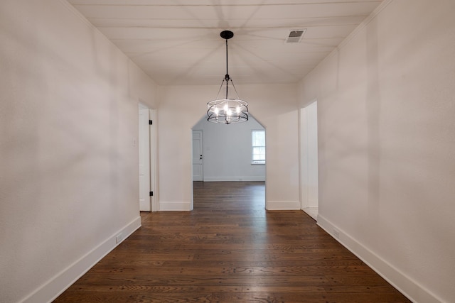 228 Palisade St, Memphis, TN 38111 - unfurnished dining area with a chandelier, baseboards, and dark wood-style floors