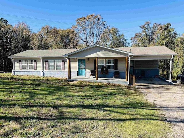 1145 Cypress Tank Rd, Pocahontas, TN 38061 - single story home with covered porch, dirt driveway, a front lawn, a carport, and brick siding