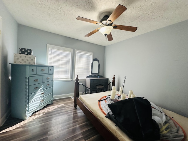 1145 Cypress Tank Rd, Pocahontas, TN 38061 - bedroom with dark wood-style floors, a ceiling fan, baseboards, and a textured ceiling