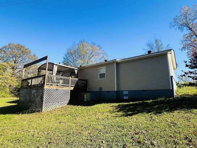 1145 Cypress Tank Rd, Pocahontas, TN 38061 - rear view of house with crawl space, a wooden deck, a yard, and central AC unit
