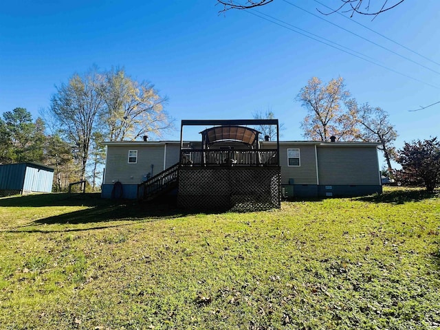 1145 Cypress Tank Rd, Pocahontas, TN 38061 - back of property featuring a deck, stairs, a yard, crawl space, and an outbuilding