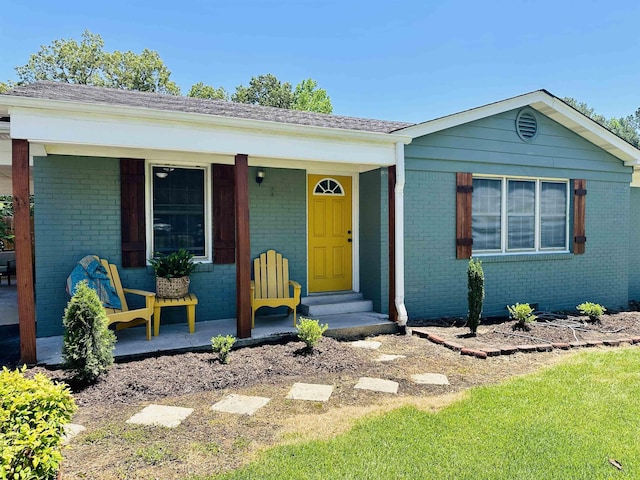 159 Hillhurst Dr, Selmer, TN 38375 - view of front of house featuring brick siding, covered porch, and a shingled roof
