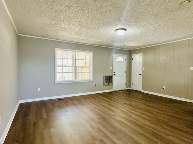 159 Hillhurst Dr, Selmer, TN 38375 - foyer entrance with heating unit, dark wood-style flooring, crown molding, baseboards, and a textured ceiling
