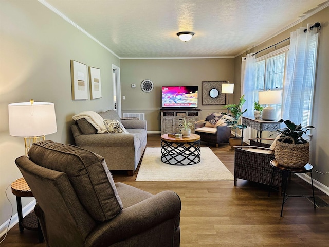 159 Hillhurst Dr, Selmer, TN 38375 - living area with wood finished floors, ornamental molding, baseboards, and a textured ceiling
