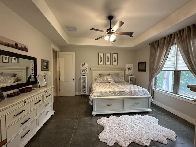 6104 Scottscraig Cv, Bartlett, TN 38135 - bedroom featuring a raised ceiling, baseboards, and a ceiling fan