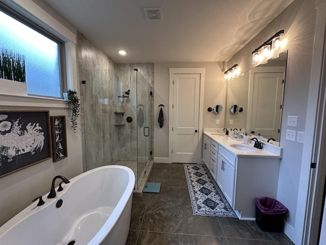 6104 Scottscraig Cv, Bartlett, TN 38135 - bathroom featuring a freestanding tub, double vanity, a shower stall, and tile patterned flooring