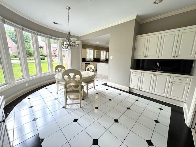 415 S Yates Cv, Memphis, TN 38120 - dining room with a chandelier, baseboards, ornamental molding, and light tile patterned floors