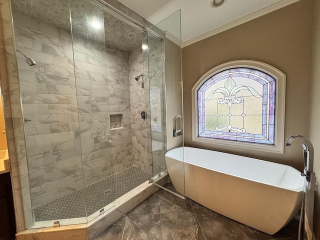 415 S Yates Cv, Memphis, TN 38120 - bathroom featuring marble finish flooring, ornamental molding, a soaking tub, a shower stall, and recessed lighting